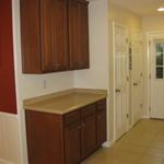 Kitchen with view of storage closets 