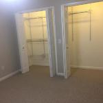 4th bedroom/office with no furniture and open view of double closets