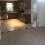 View of kitchen from dining room with no furniture and updated paint